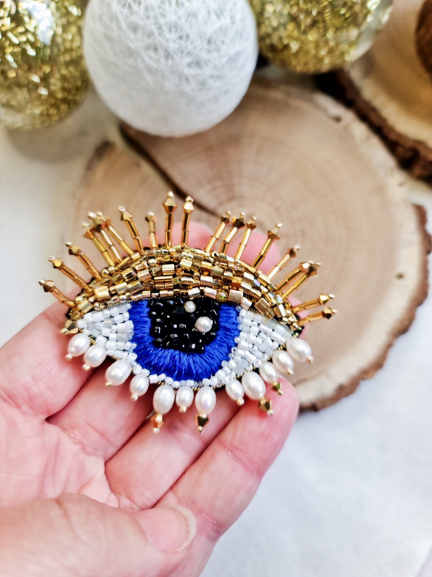 Close-up view of the intricate eye motif on the Enchanting Gaze Eye Brooch, showcasing detailed craftsmanship and unique design elements