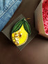 Large lemon beaded brooch hand embroidered with yellow crystals green leaves and bead details