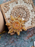 Sun and moon beaded brooches hand embroidered with crystals pearls and celestial details