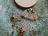 Blush pink jellyfish beaded brooch with crystal top and long beaded fringe tentacles