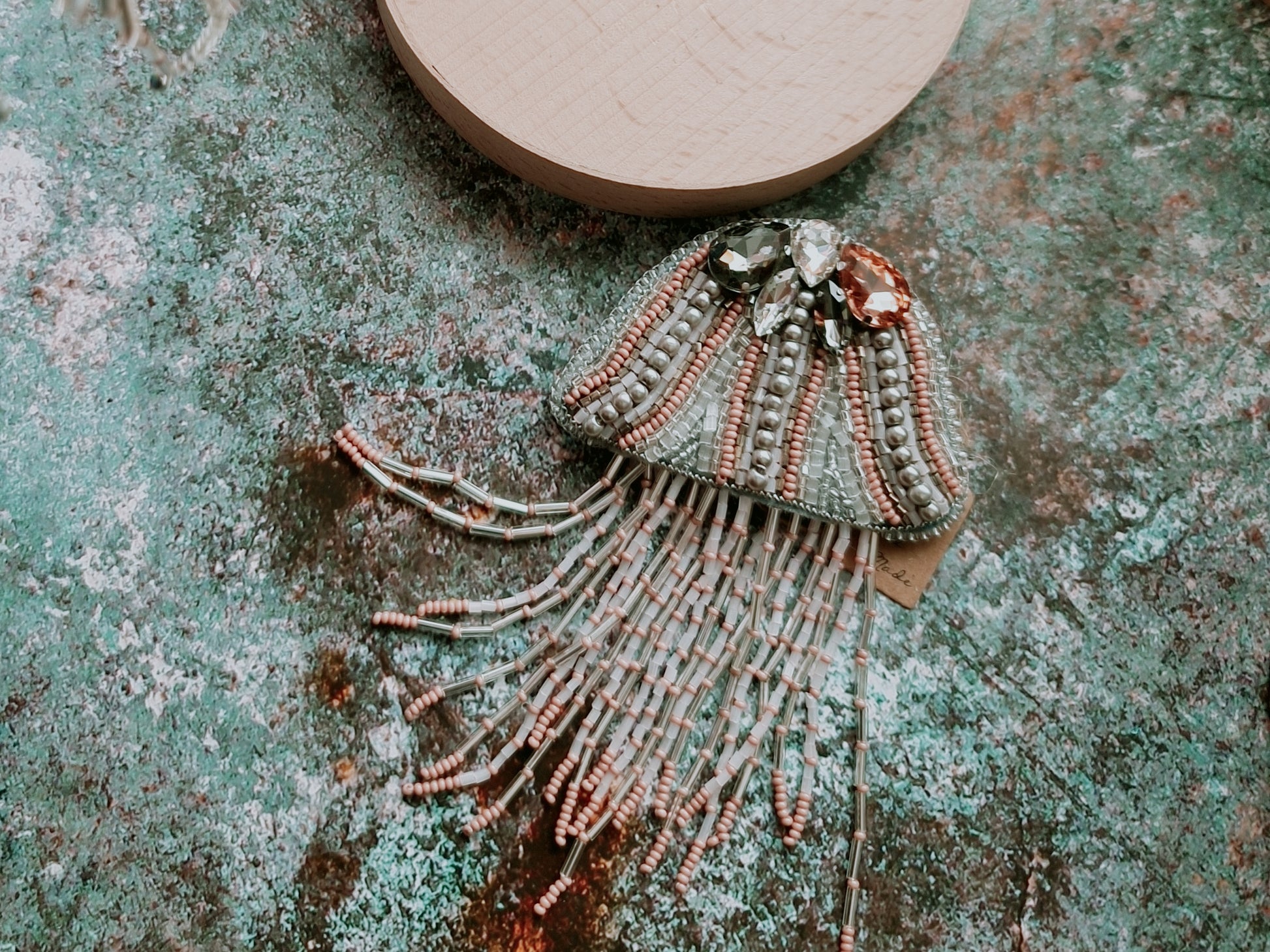 Blush pink jellyfish beaded brooch with crystal top and long beaded fringe tentacles