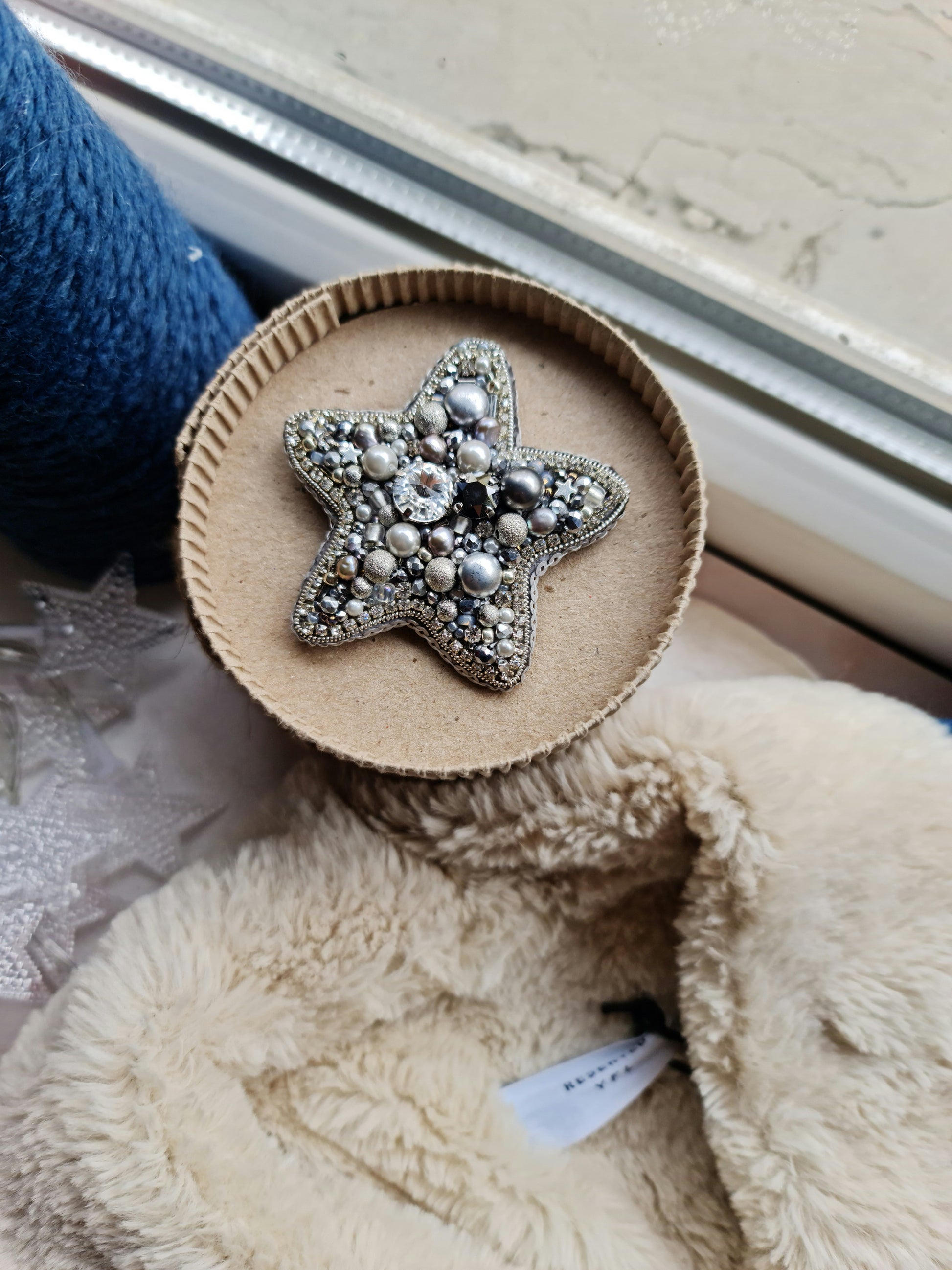 Silver star beaded brooch