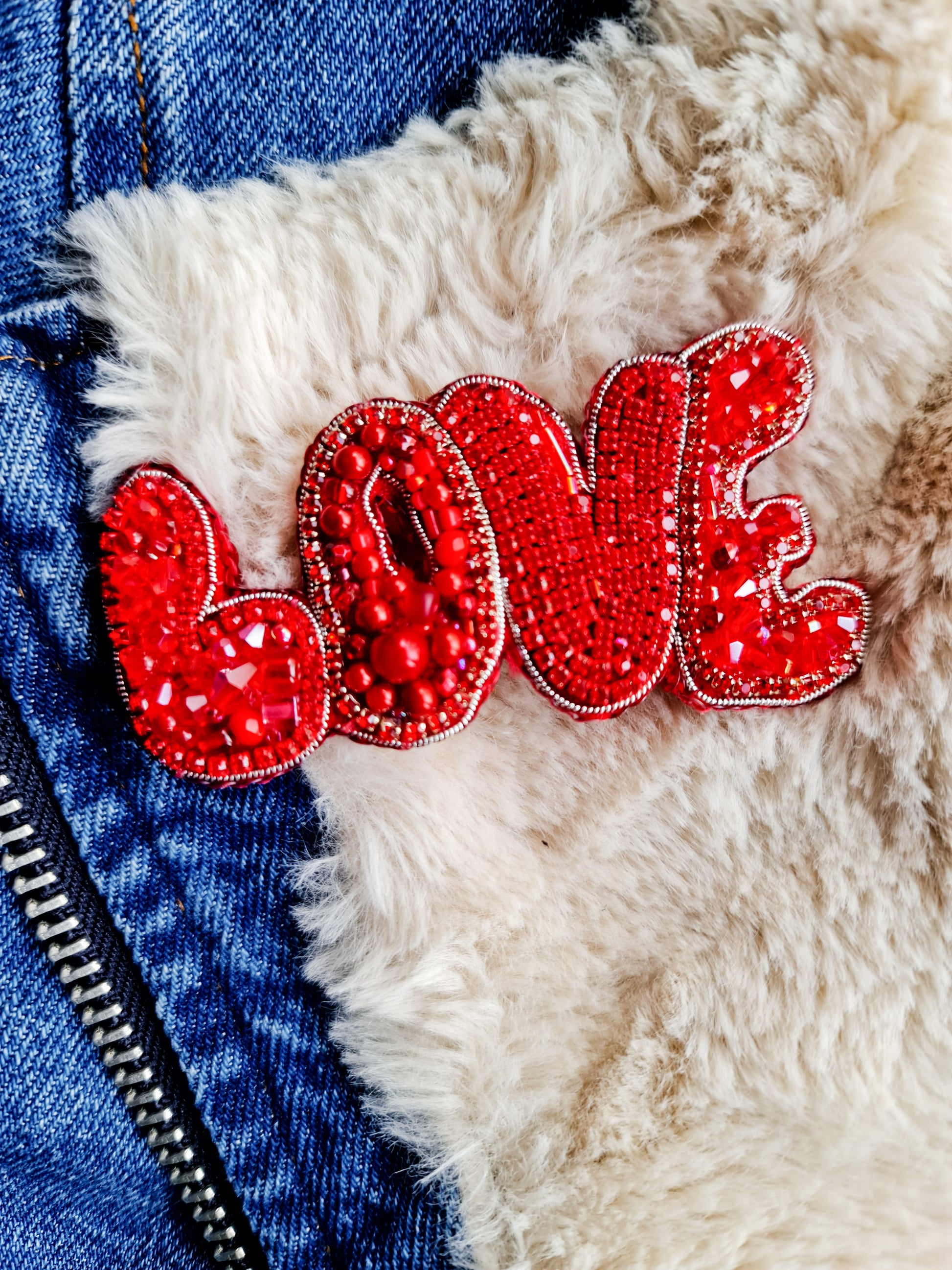 Red 'LOVE' patch on a textured surface