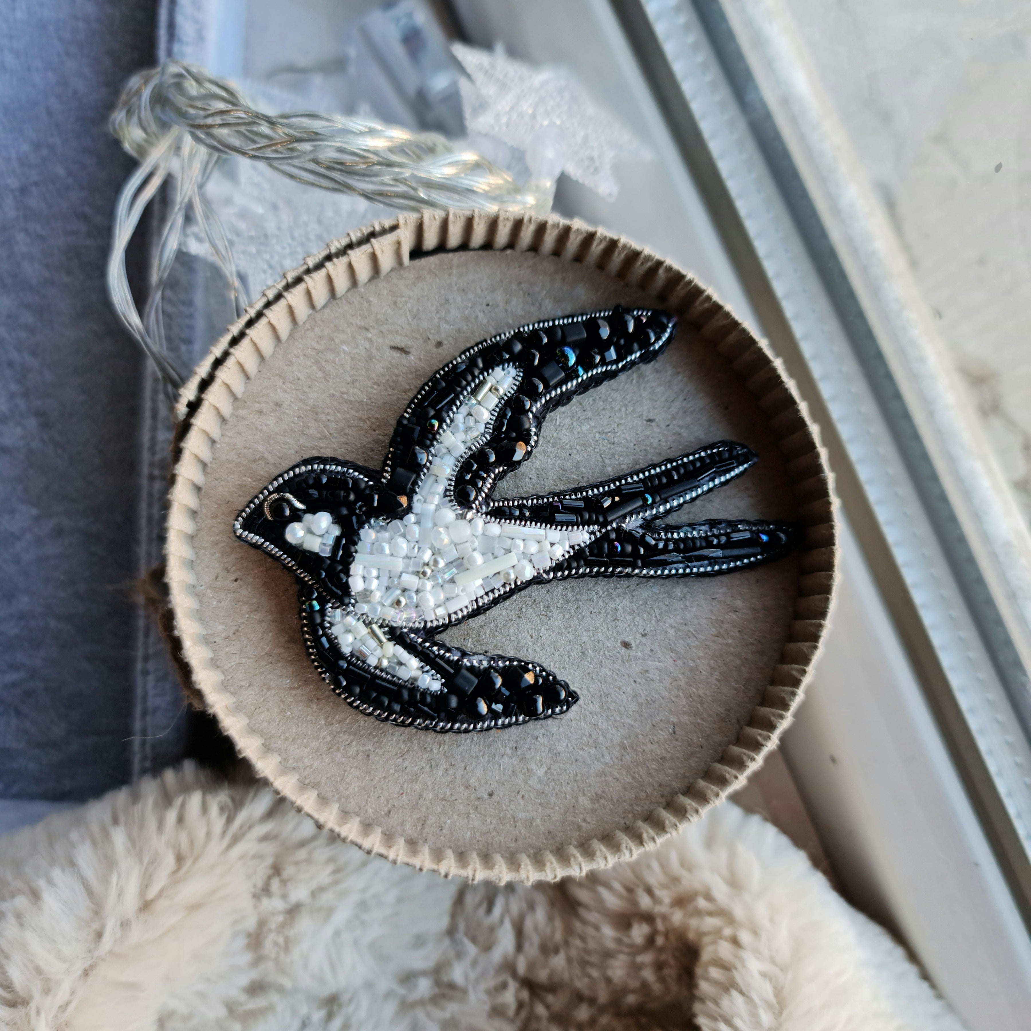 Black and white swallow beaded brooch hand embroidered with glass beads crystals and bird wing details
