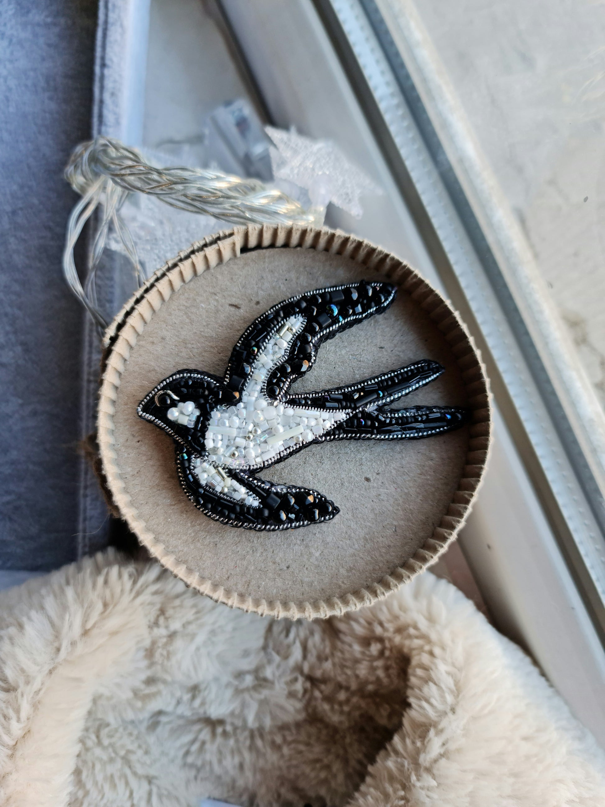 Black and white swallow beaded brooch hand embroidered with glass beads crystals and bird wing details