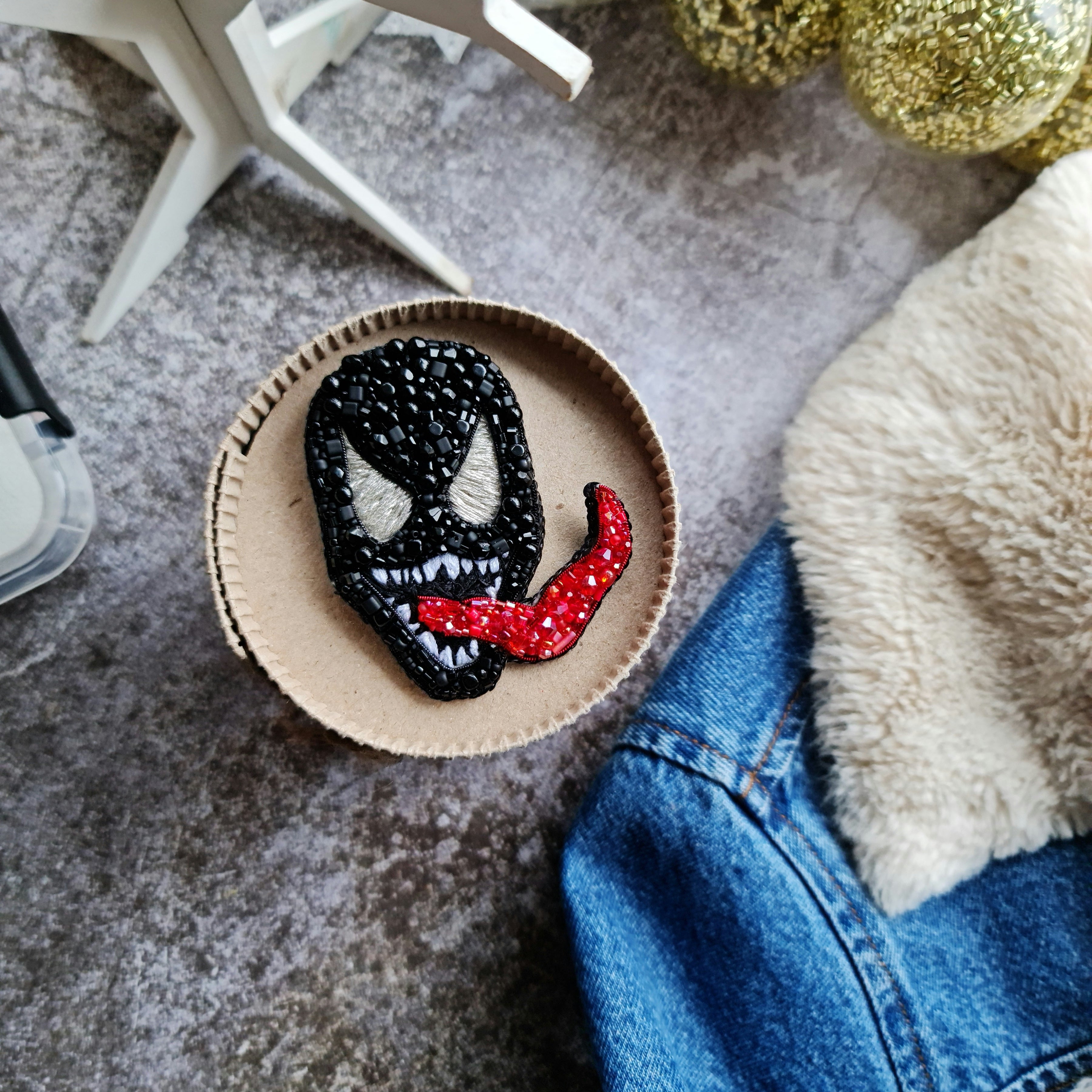 Black monster beaded brooch hand embroidered with white eyes teeth and red tongue