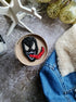 Black monster beaded brooch hand embroidered with white eyes teeth and red tongue
