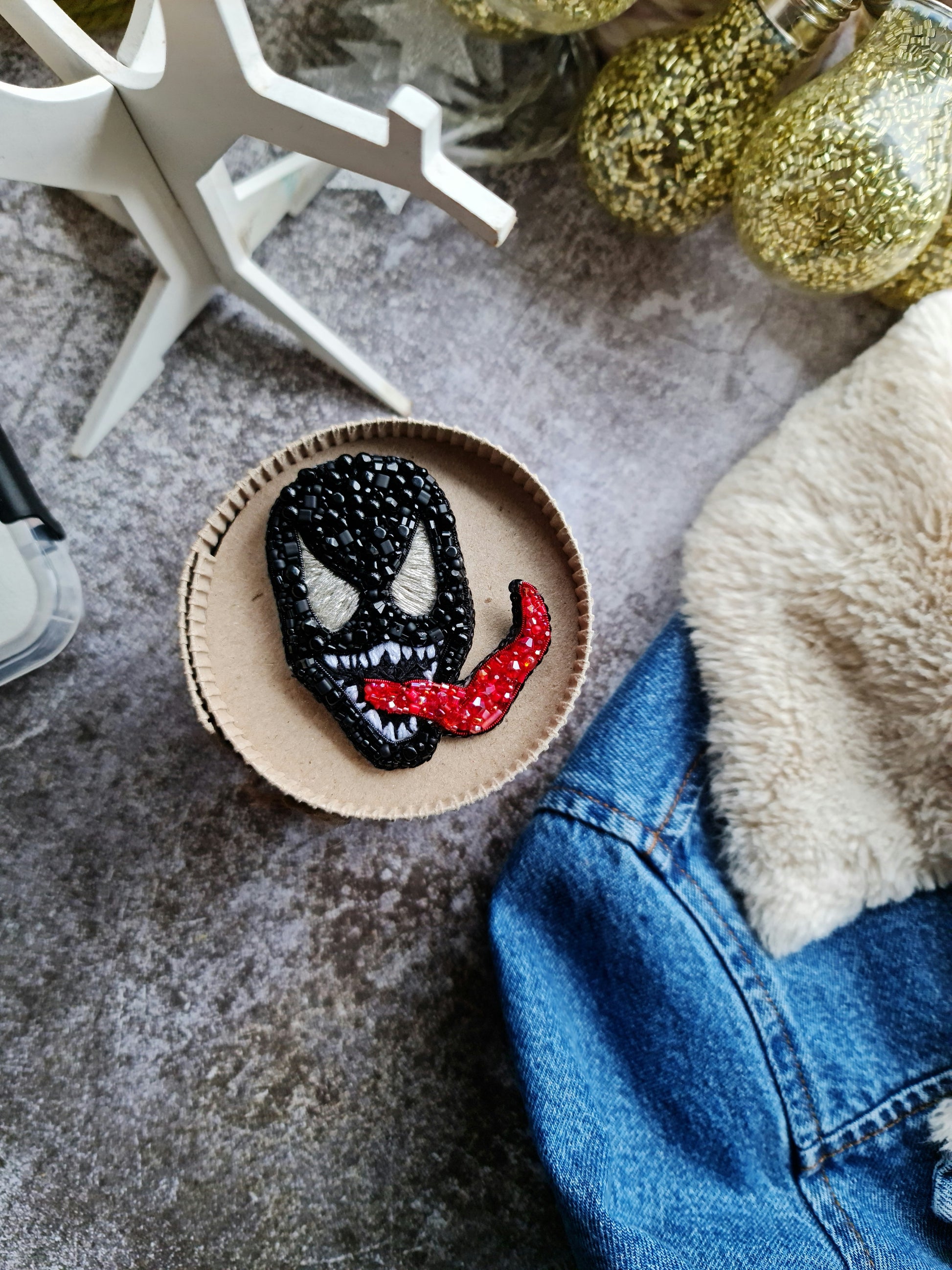 Black monster beaded brooch hand embroidered with white eyes teeth and red tongue