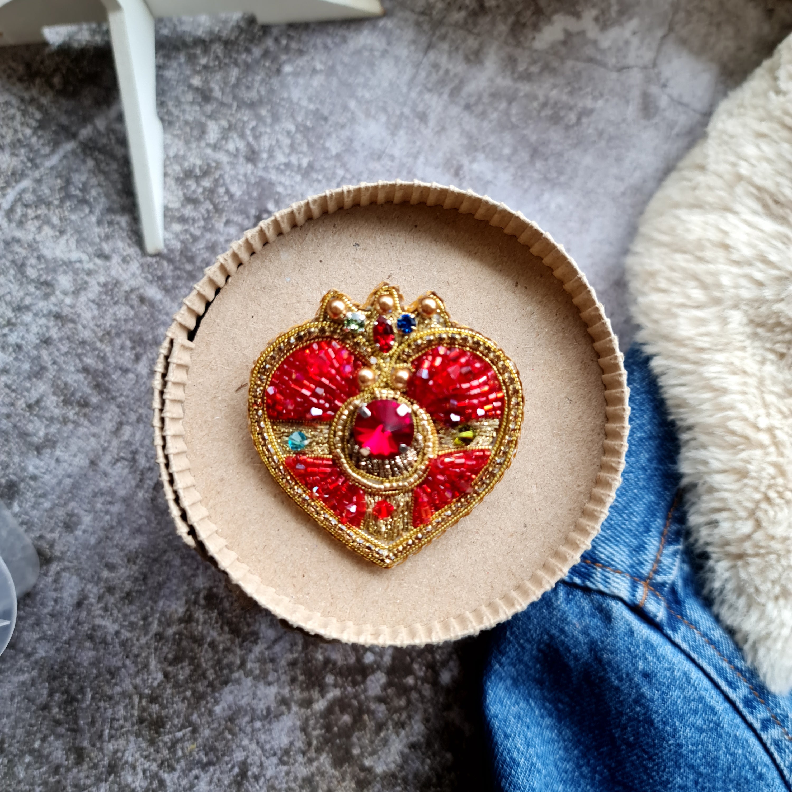 Handmade beaded brooch inspired by magical girl anime, featuring intricate embroidery and shimmering beads in a celestial moon design.