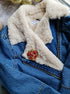 Anime-inspired moon brooch pinned to a denim jacket, adding a touch of kawaii fashion and celestial elegance