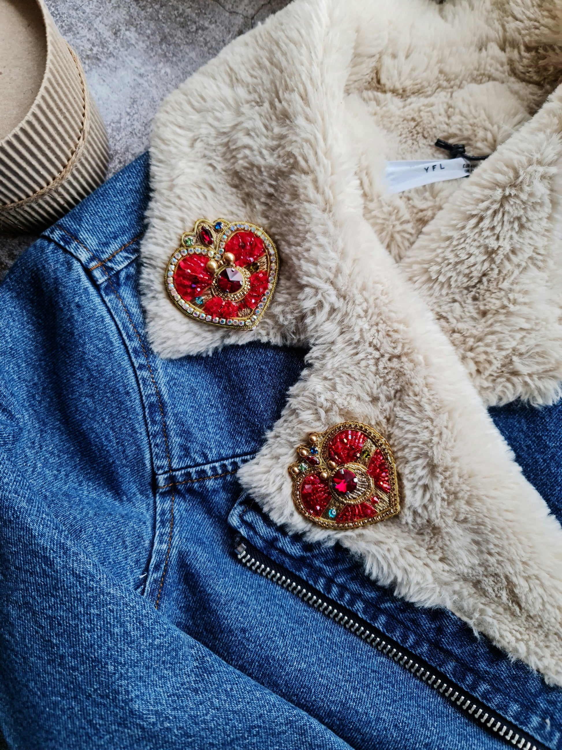 Anime-inspired moon brooch pinned to a denim jacket, adding a touch of kawaii fashion and celestial elegance