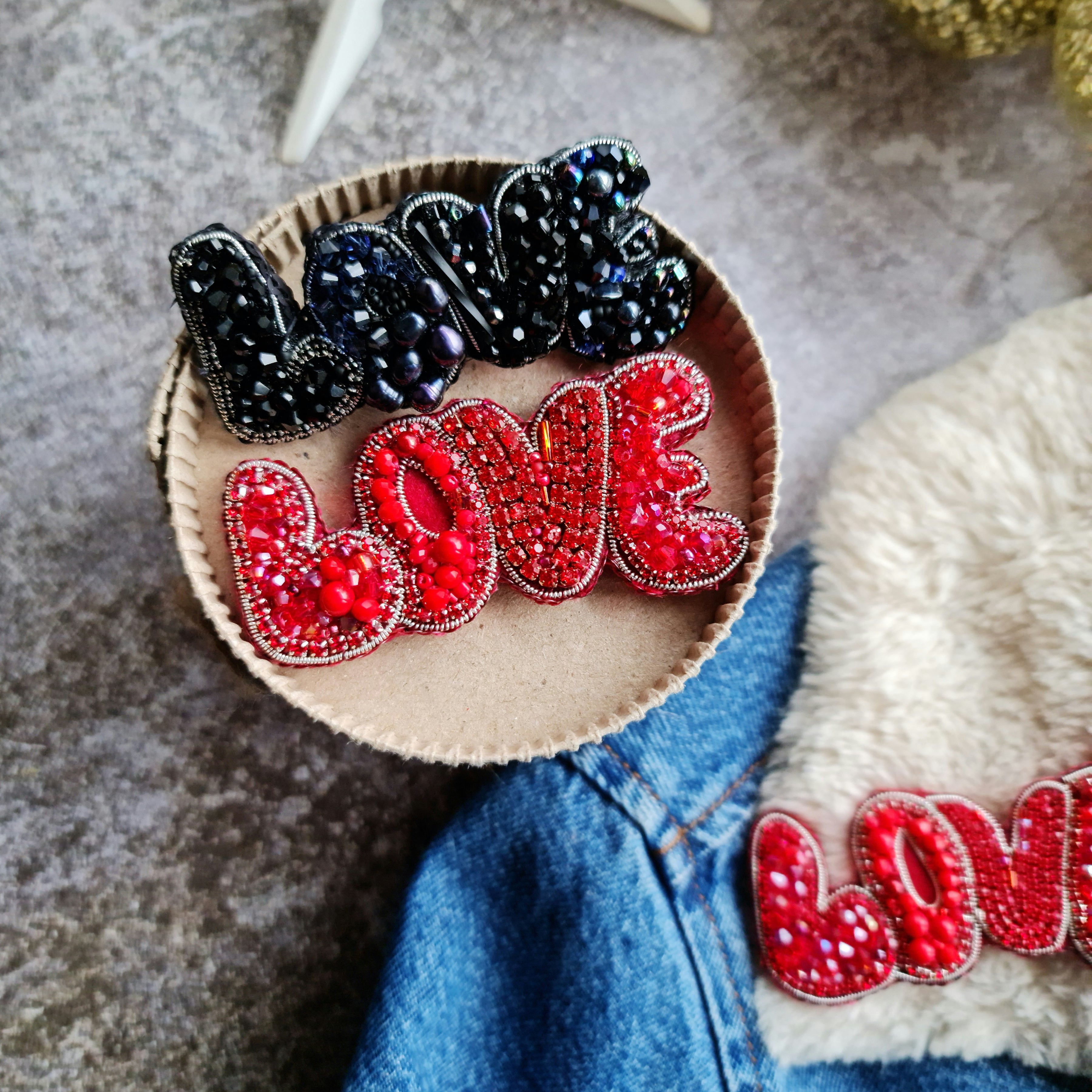 Love beaded brooch hand embroidered in red and black colors with crystals beads and metallic details