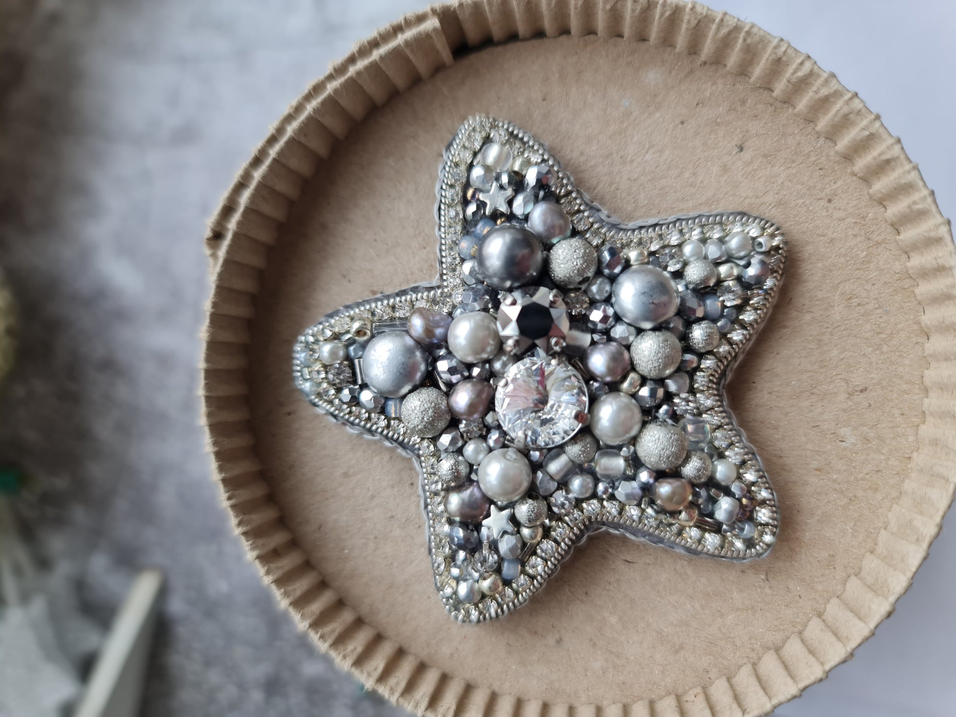 Silver star beaded brooch