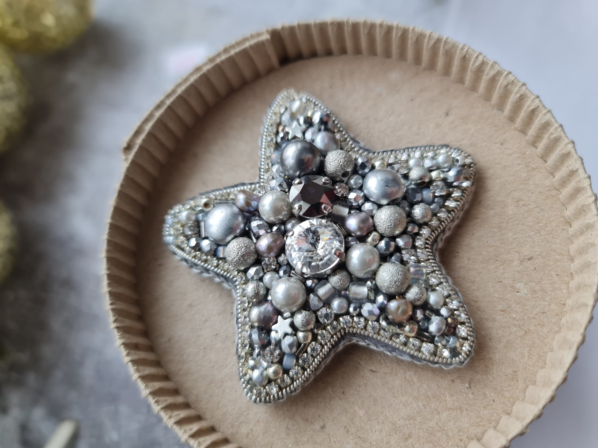 Silver star beaded brooch