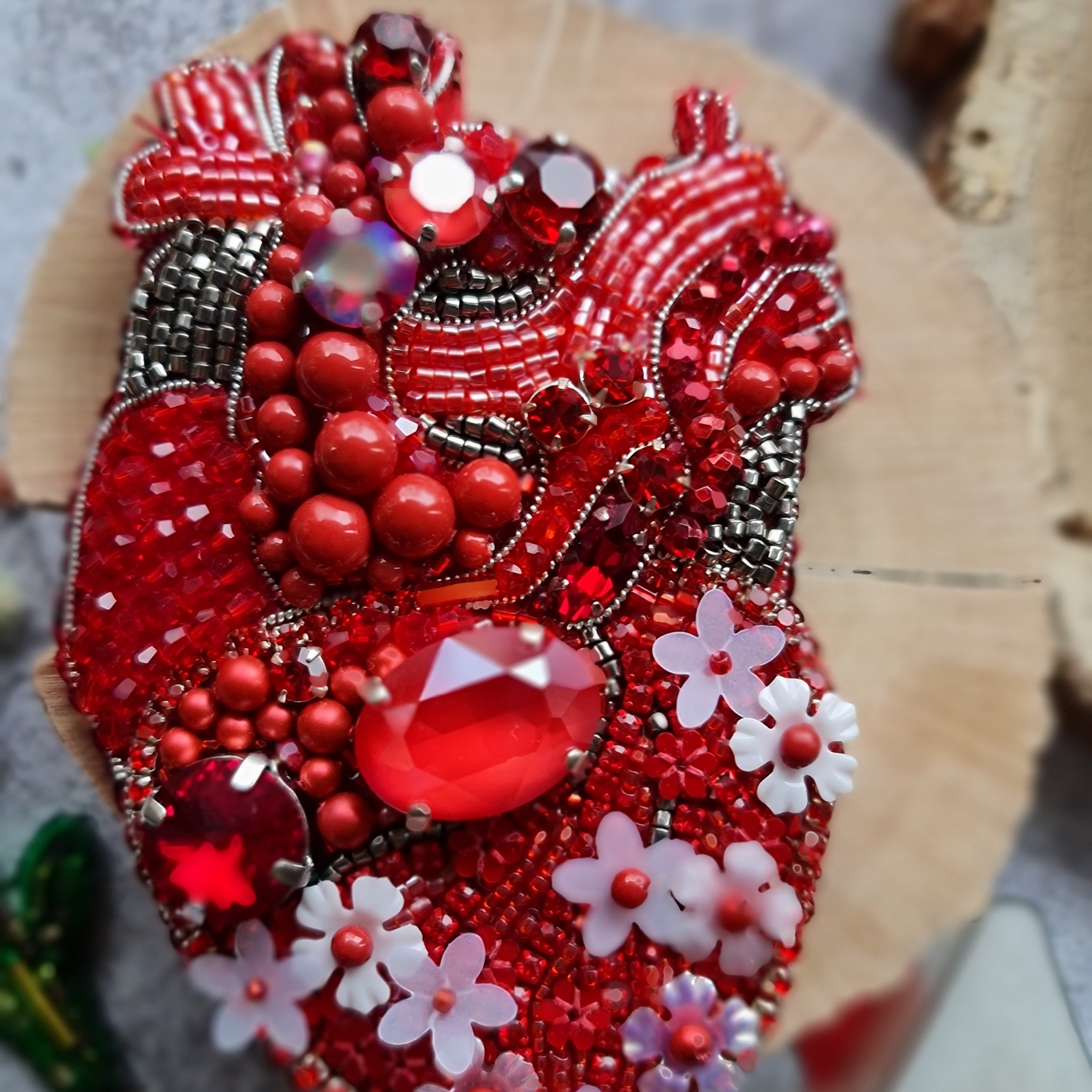 Red anatomical heart beaded brooch hand embroidered with crystals flowers and blue details