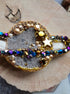 Hand embroidered Saturn planet brooch with beads crystals sequins and celestial details