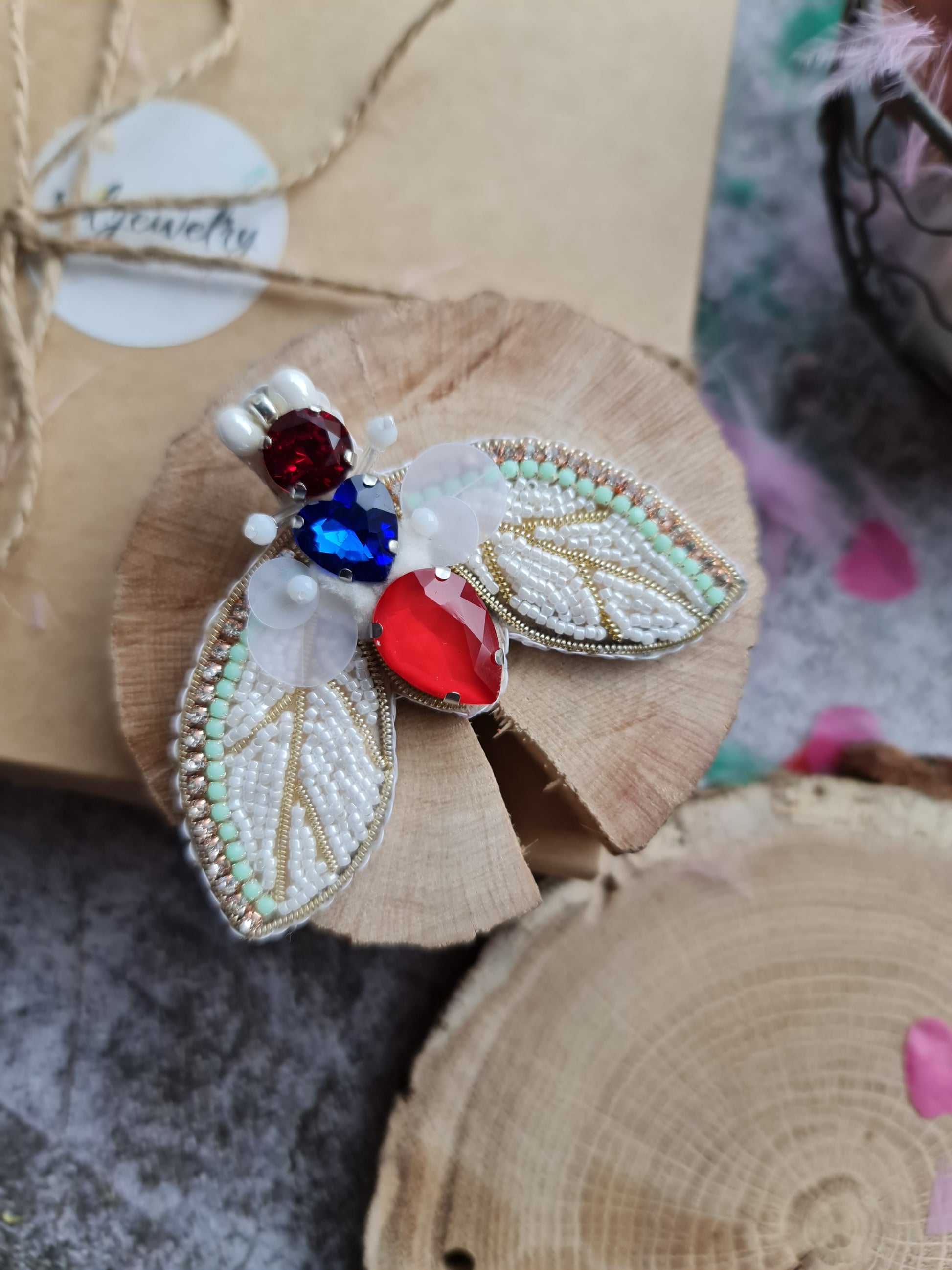 White moth beaded brooch hand embroidered with yellow stone crystals sequins and bead details