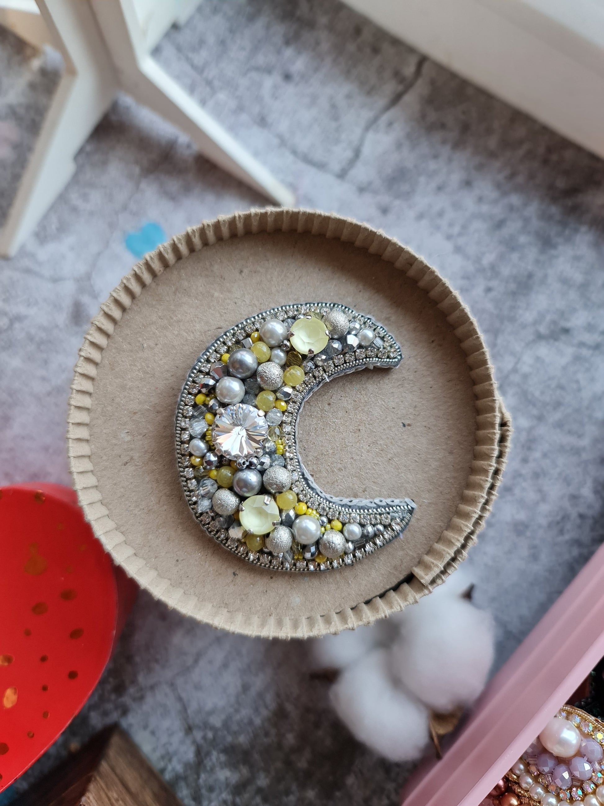Sun and moon beaded brooches hand embroidered with crystals pearls and celestial details