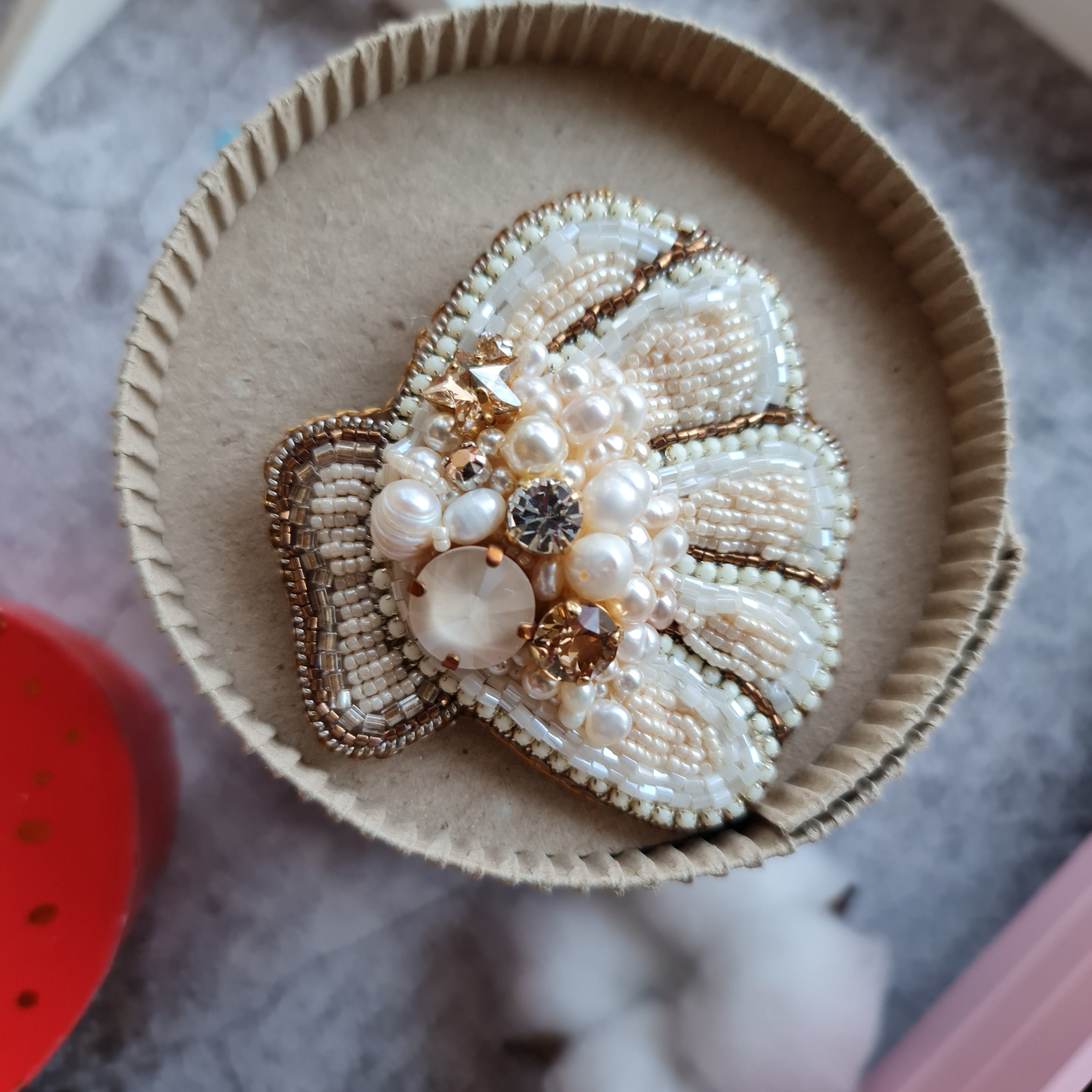 Round pearl shell beaded brooch hand embroidered with pearls crystals and beads in soft ivory and champagne tones