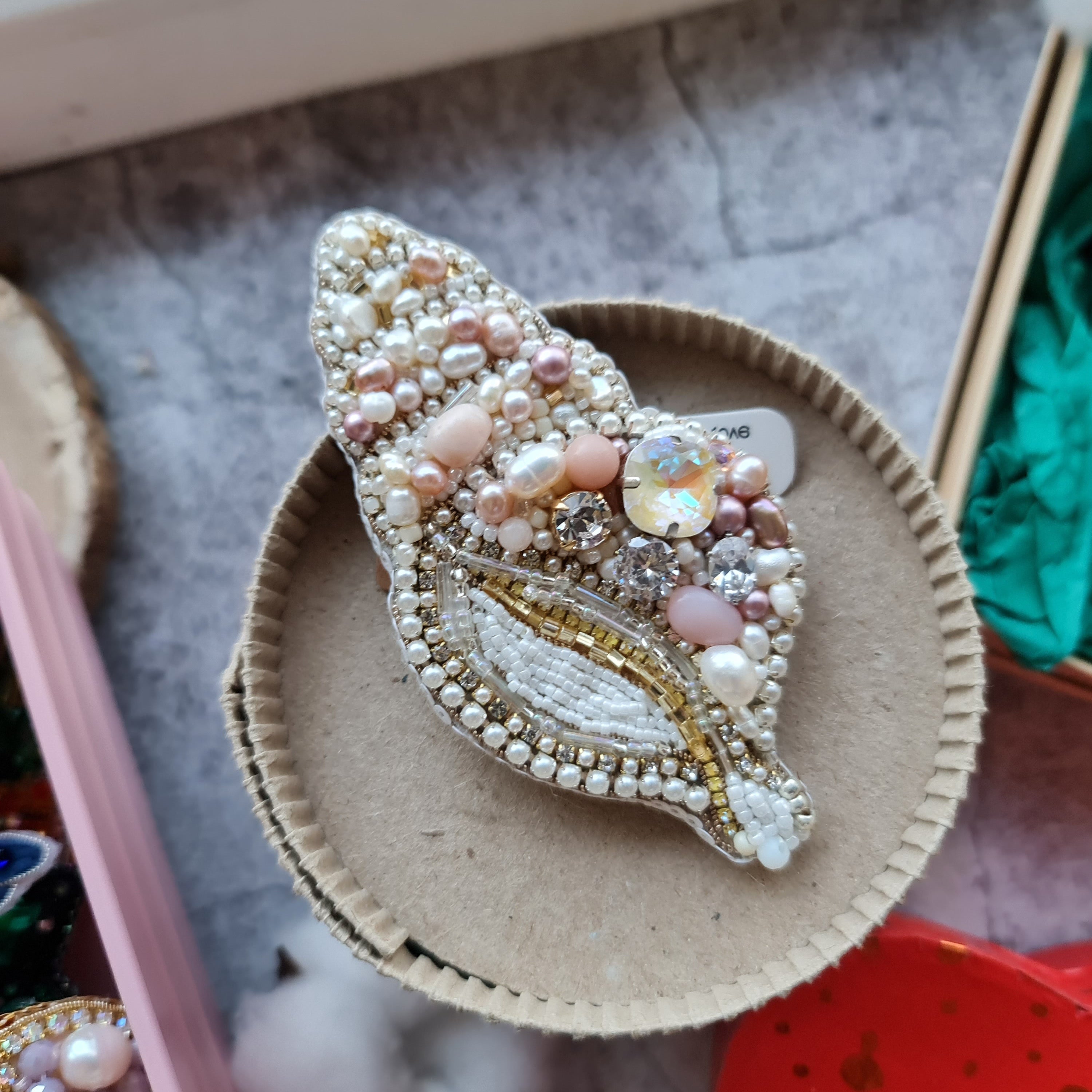 Spiral pearl shell beaded brooch hand embroidered with pearls crystals and beads in ivory blush and gold tones