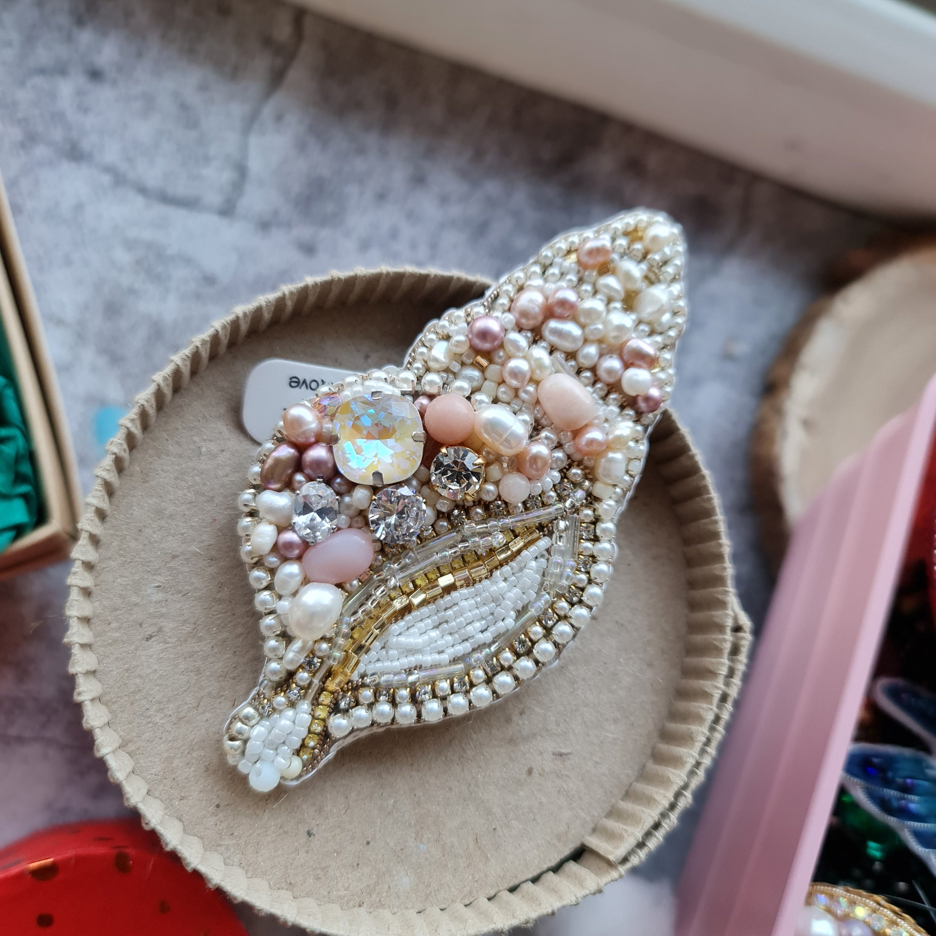 Spiral pearl shell beaded brooch hand embroidered with pearls crystals and beads in ivory blush and gold tones