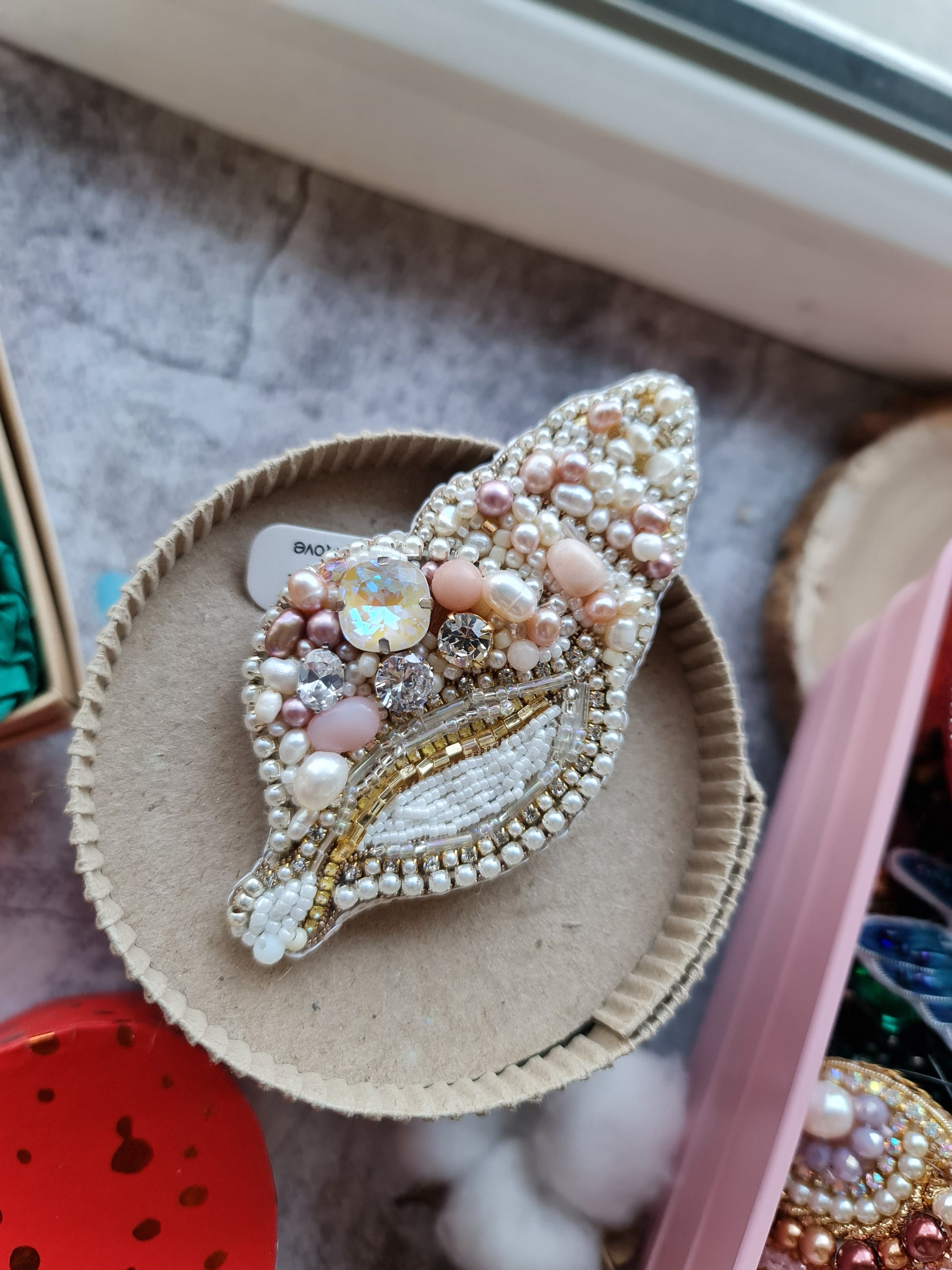 Spiral pearl shell beaded brooch hand embroidered with pearls crystals and beads in ivory blush and gold tones