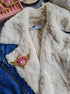 Anime-inspired Cosmic Heart Compact Brooch pinned on a jacket, showcasing its intricate beaded design and celestial heart details, measuring 2.36 inches x 3.74 inches