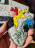 Colorful anatomical heart brooch hand embroidered with bright thread and bead details