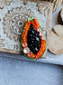 Papaya beaded brooch hand embroidered with orange beads black seed details green edge and sparkling crystals