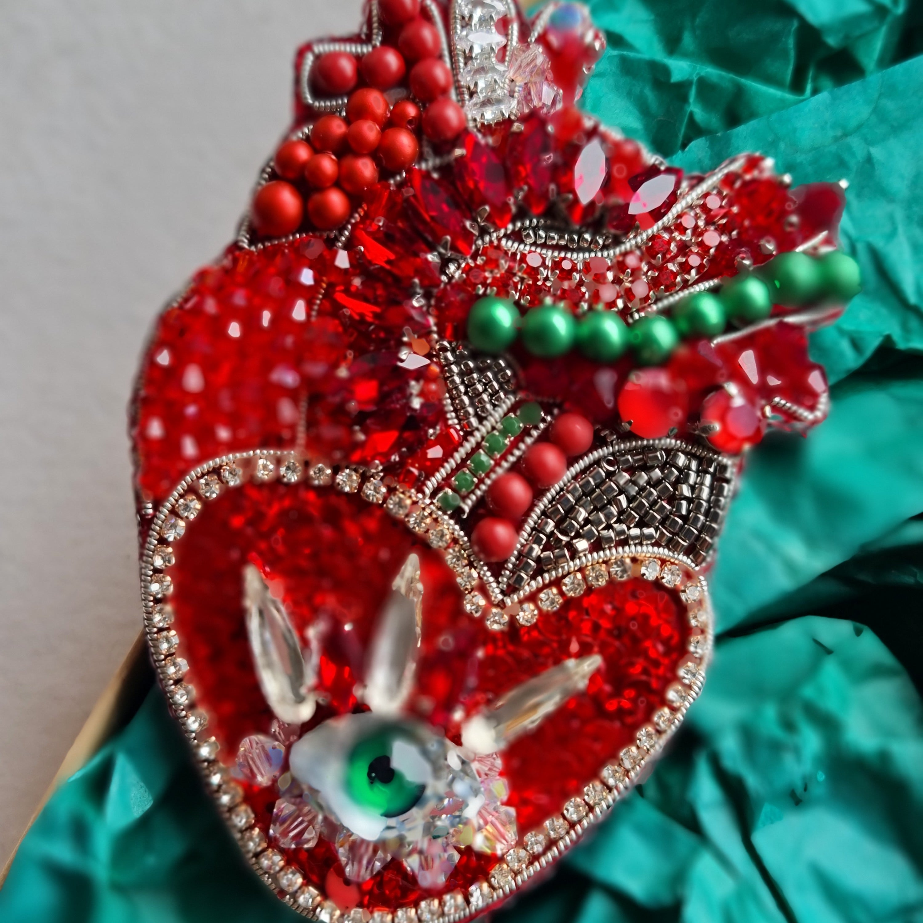Red anatomical heart brooch with green eye, hand embroidered with beads and crystals
