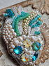 Pearl anatomical heart beaded brooch hand embroidered with turquoise crystals and pearl details