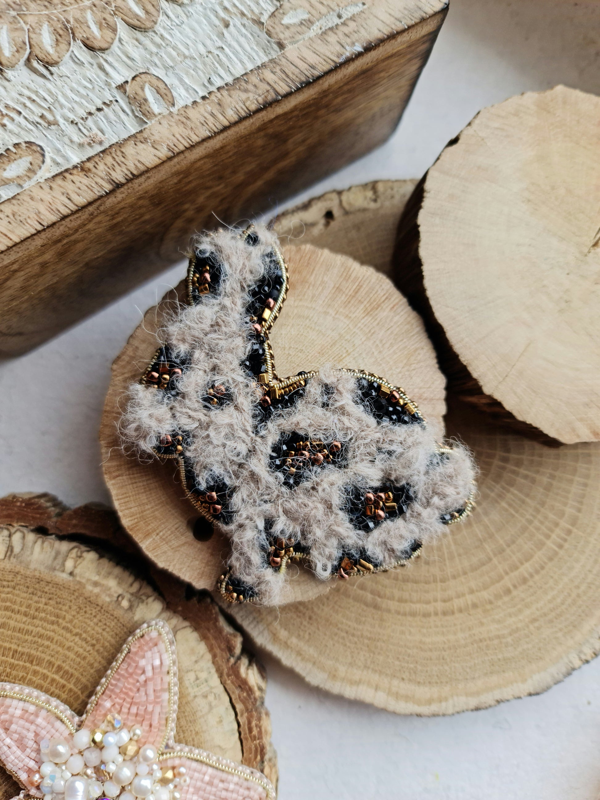 Spotted bunny beaded brooch hand embroidered with fluffy texture black spots and gold details