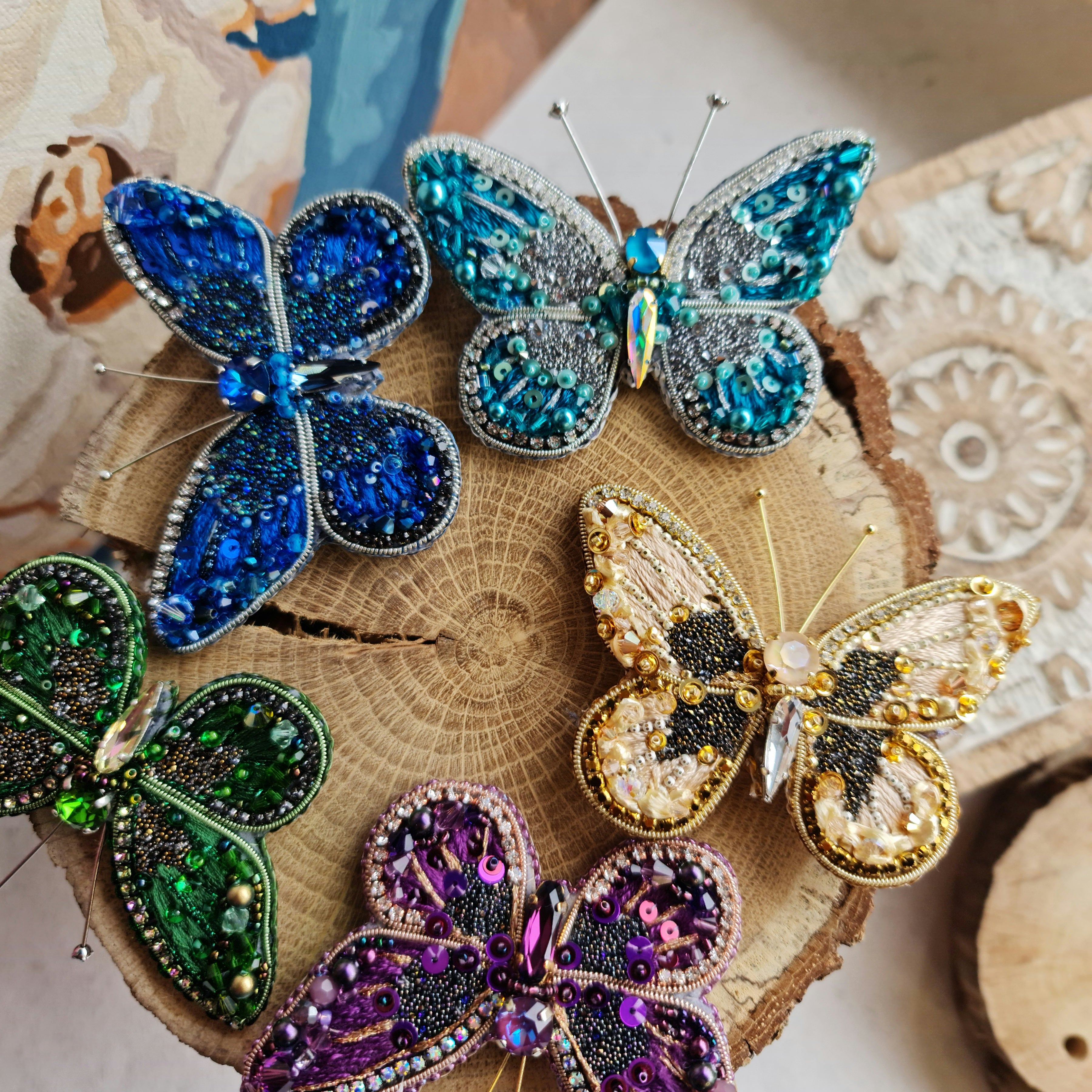 Butterfly beaded brooches hand embroidered in six colors with crystals sequins and bead details