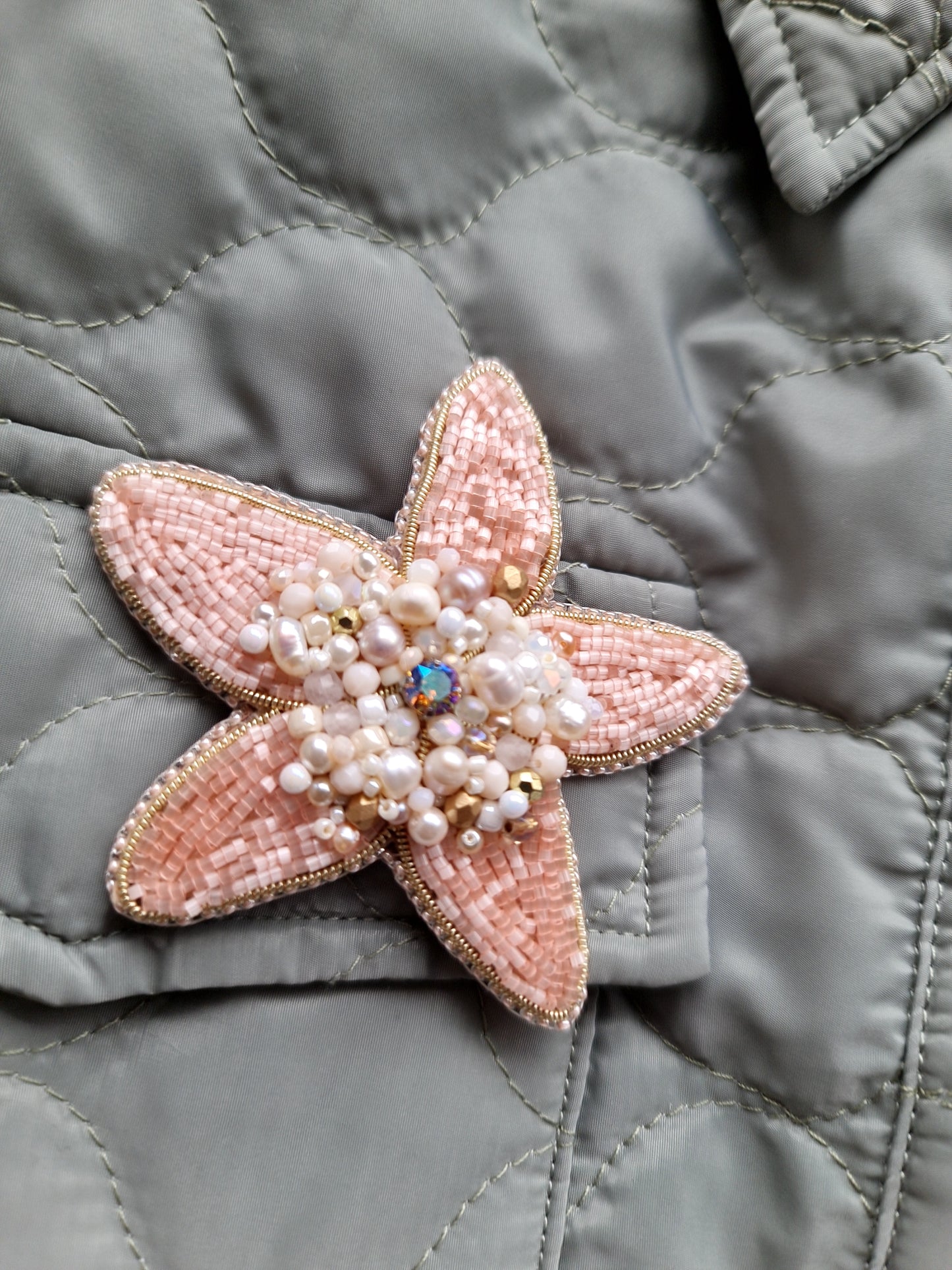 Close-up of the Stellar Seas Starfish Brooch showcasing detailed beadwork and embroidery with delicate Japanese beads, crystals, and pearls on a starfish design.
