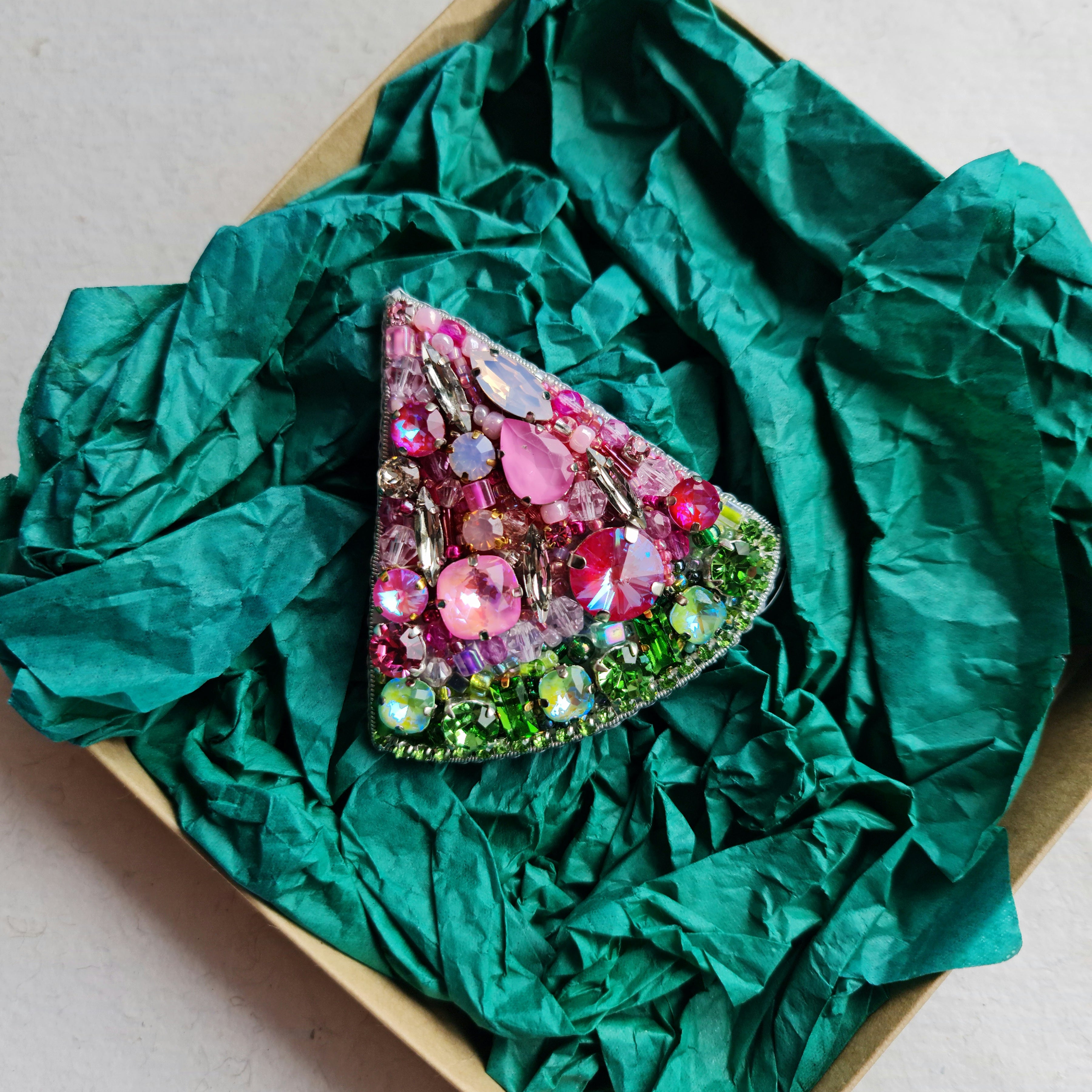 Watermelon slice beaded brooch hand embroidered with pink crystals, green beads, black seed details, and sparkling fruit design