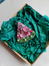 Watermelon slice beaded brooch hand embroidered with pink crystals, green beads, black seed details, and sparkling fruit design