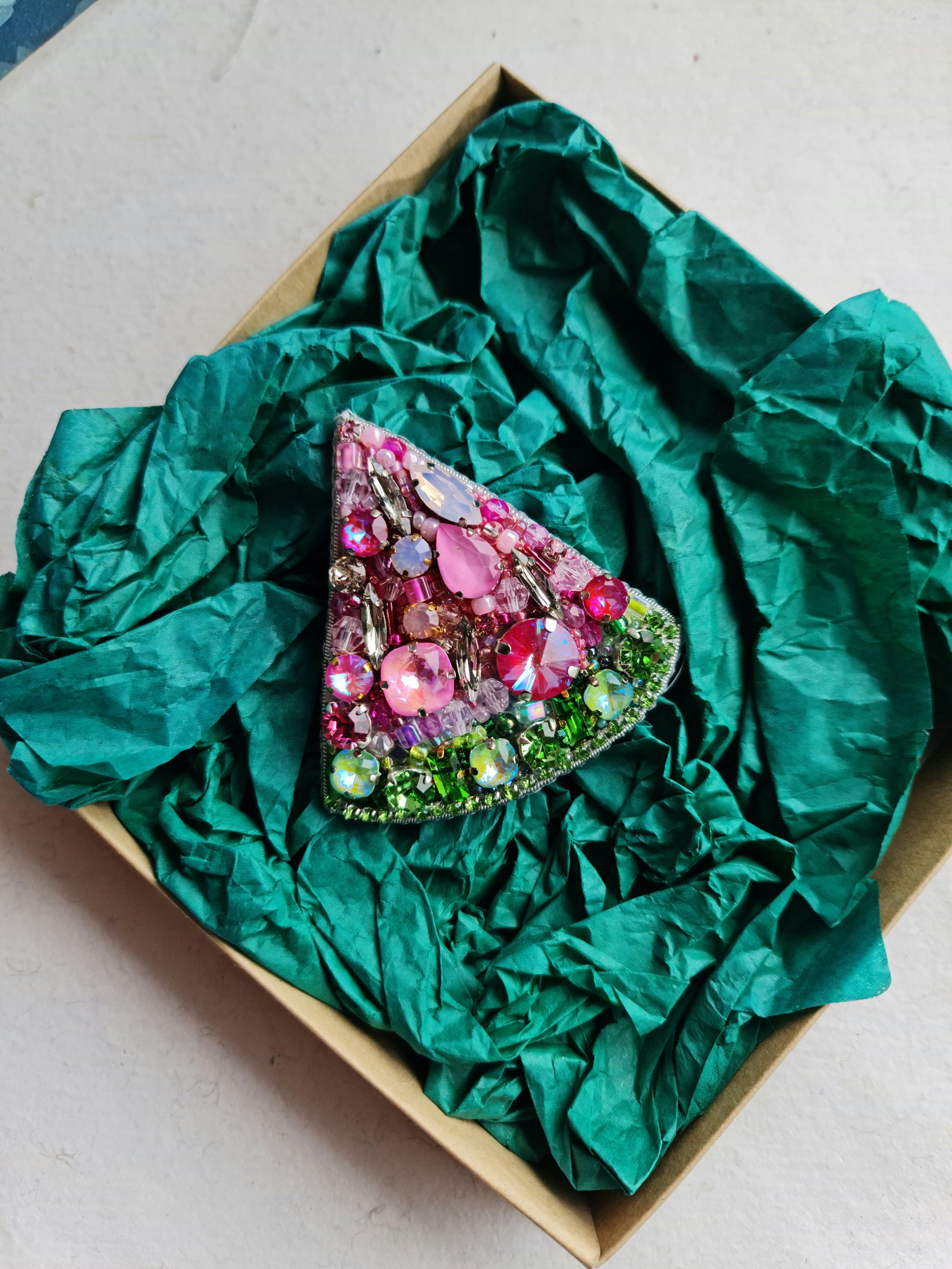 Watermelon slice beaded brooch hand embroidered with pink crystals, green beads, black seed details, and sparkling fruit design