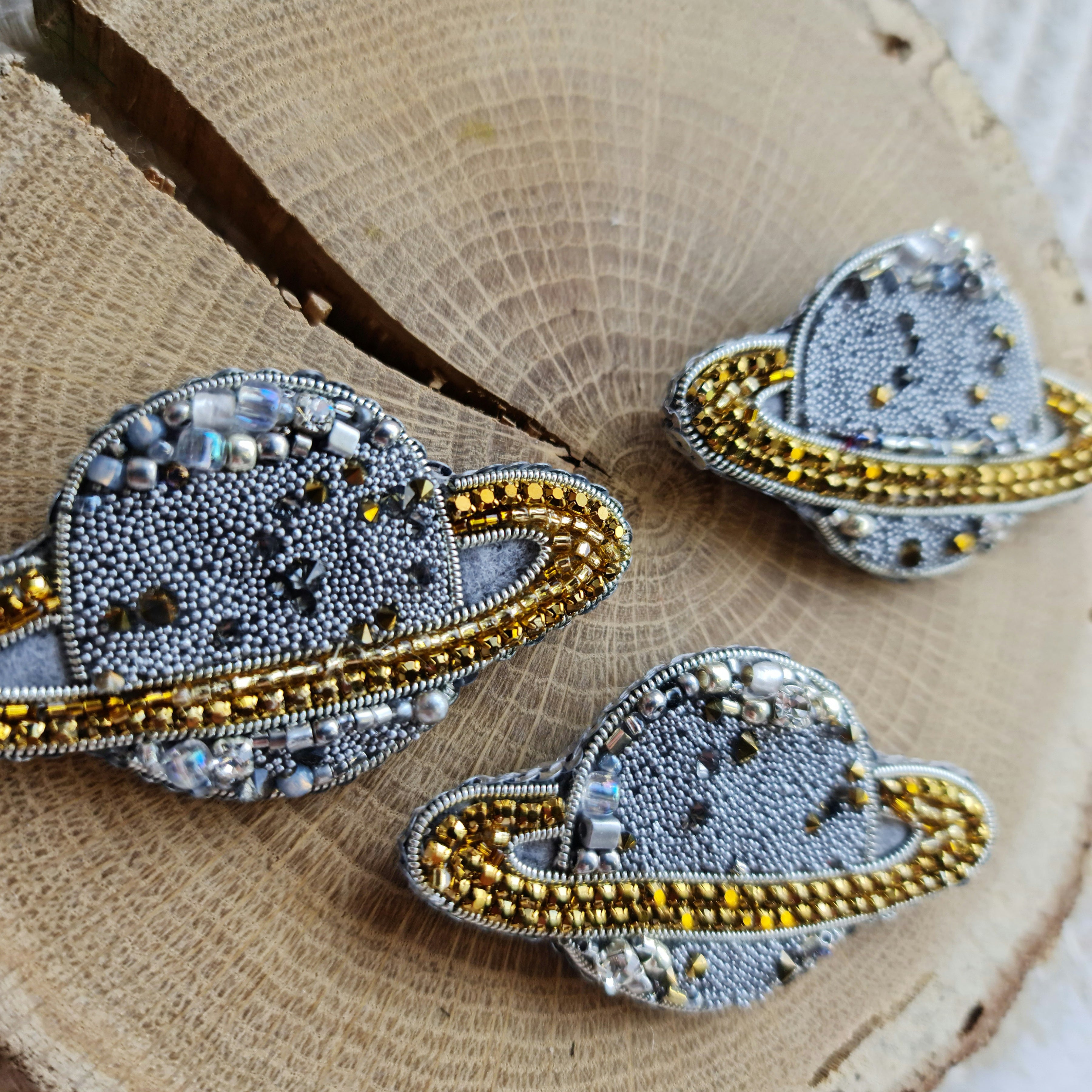 Mini Saturn beaded brooches hand embroidered in gold beige purple pink and light green colors with crystal details