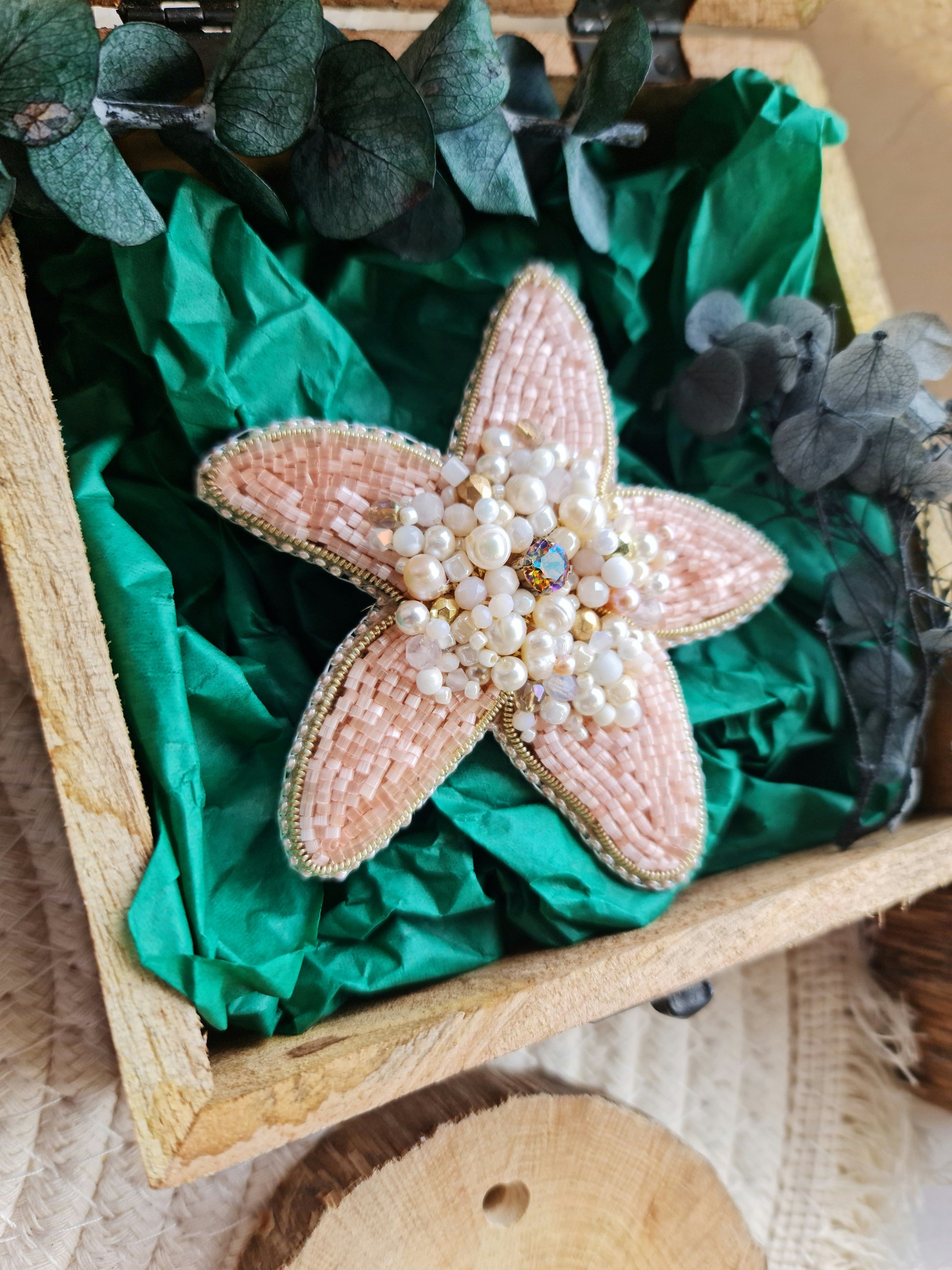 Close-up of the Stellar Seas Starfish Brooch showcasing detailed beadwork and embroidery with delicate Japanese beads, crystals, and pearls on a starfish design.