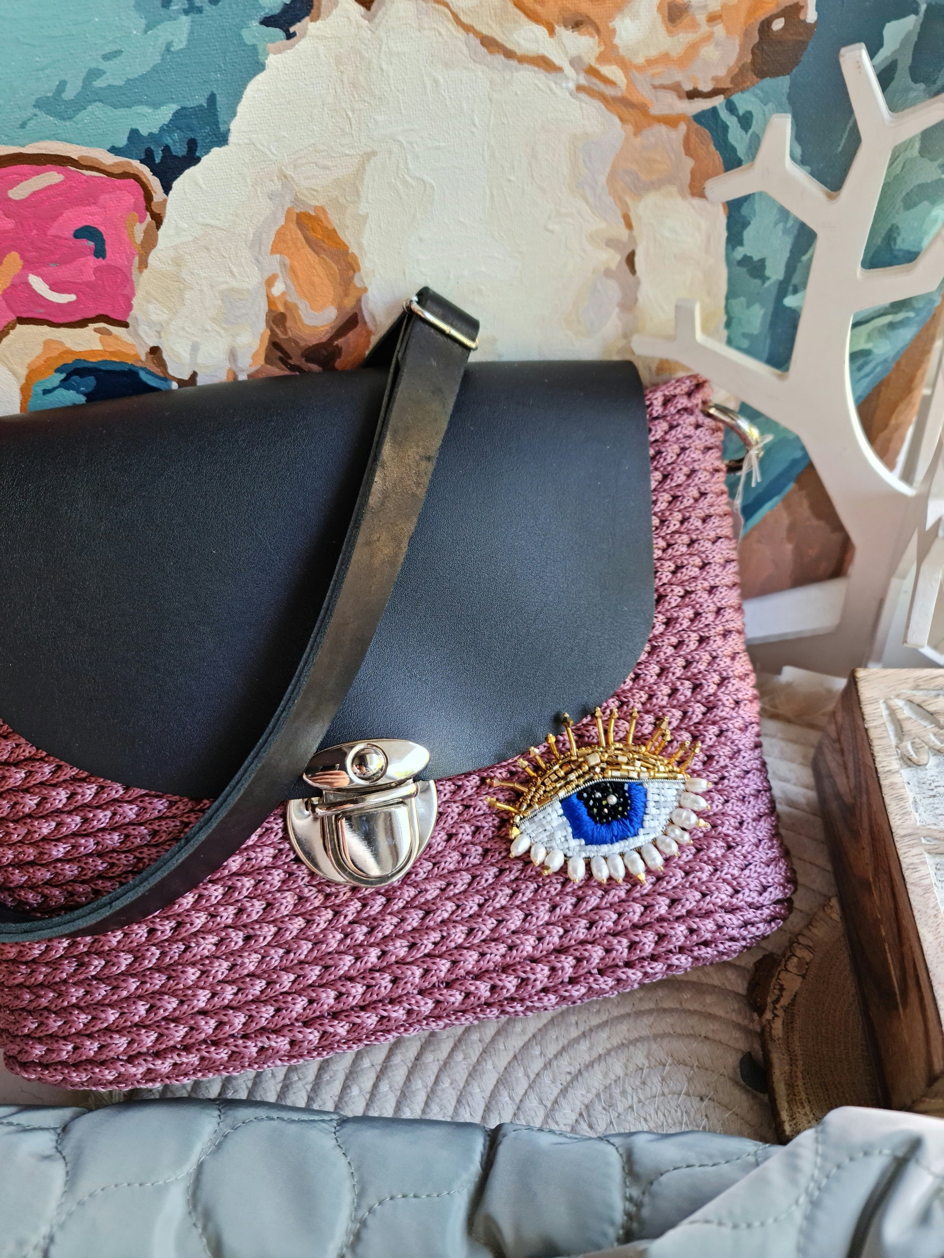 Model wearing the Enchanting Gaze Eye Brooch, an elegant accessory that adds a touch of mystique and sophistication to any outfit