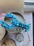 Handcrafted Blue Lobster Brooch with detailed design and secure fastening, ideal for ocean-inspired style and unique jewelry collections.