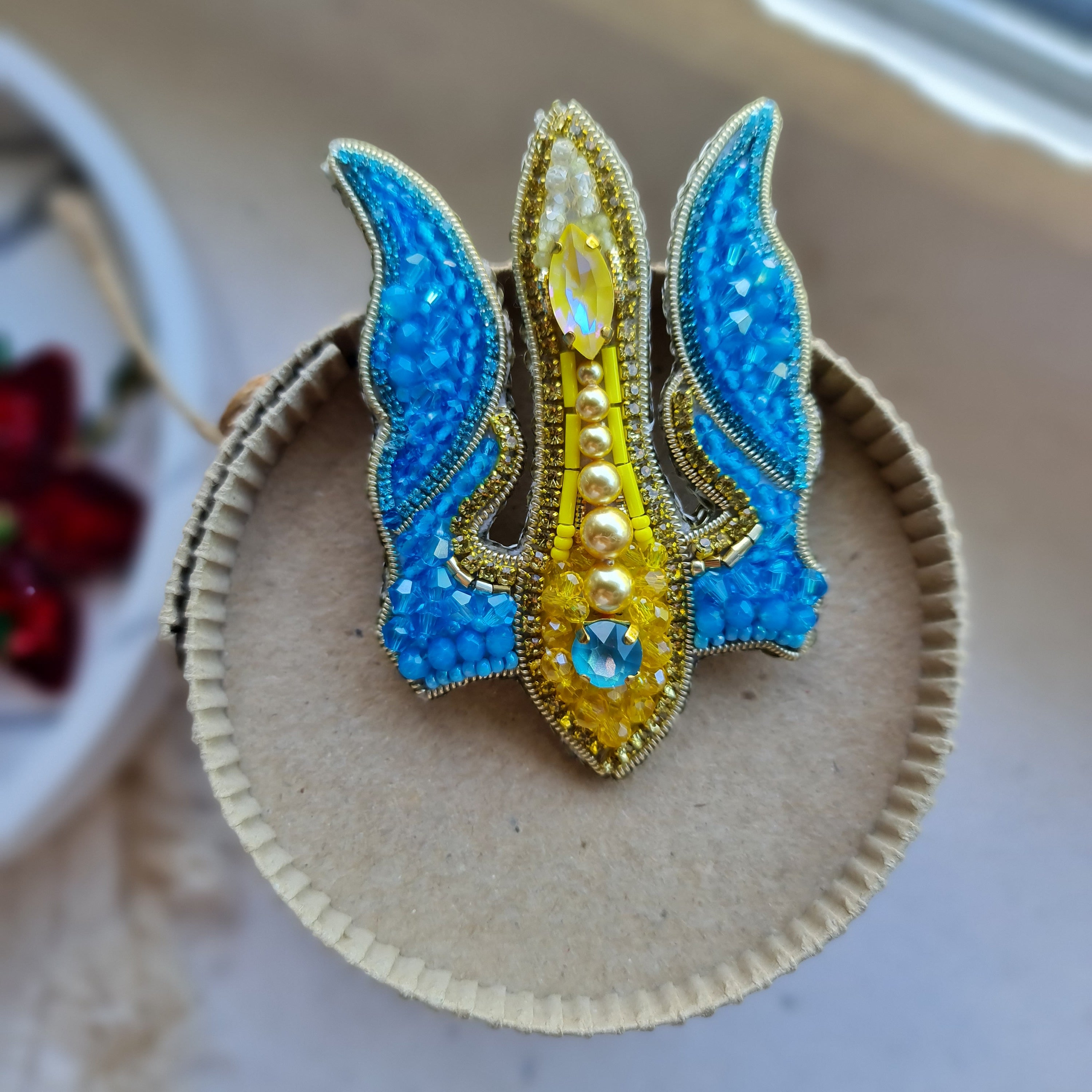 Blue and yellow trident beaded brooch hand embroidered with crystals, pearls, glass beads, and sparkling Ukraine-inspired details