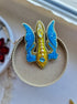 Blue and yellow trident beaded brooch hand embroidered with crystals, pearls, glass beads, and sparkling Ukraine-inspired details