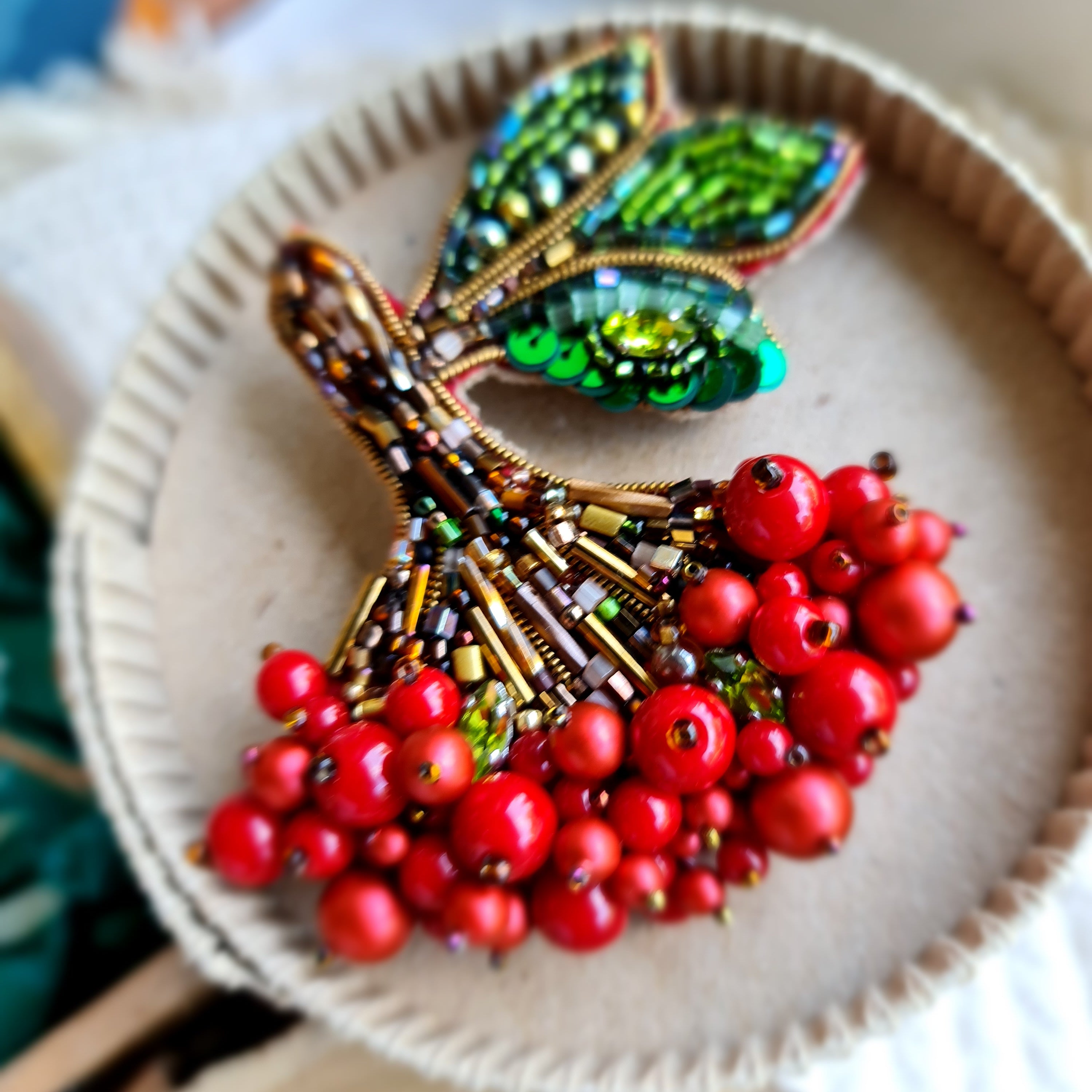 Red berry branch beaded brooch hand embroidered with green leaves and bead details