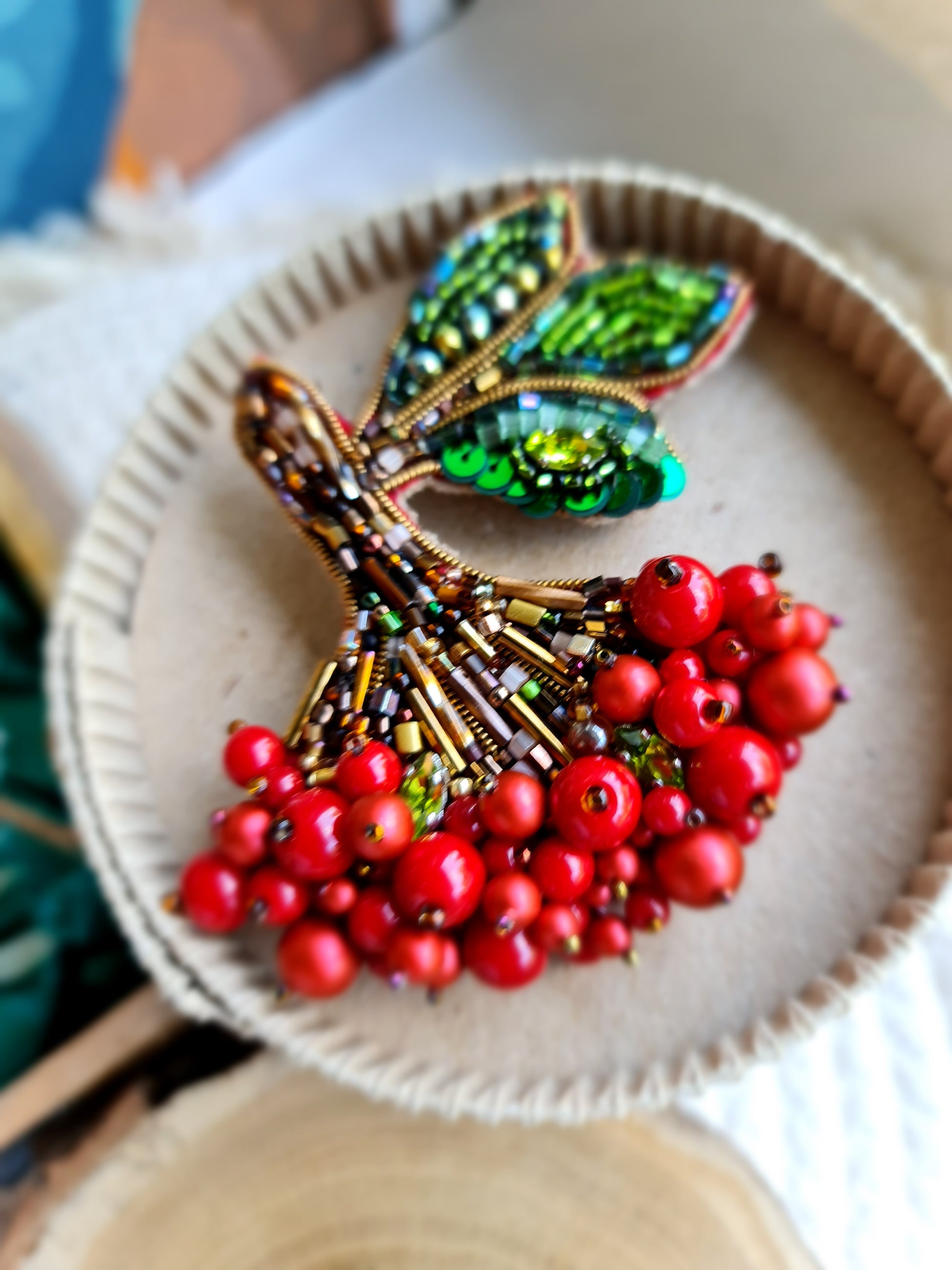 Red berry branch beaded brooch hand embroidered with green leaves and bead details