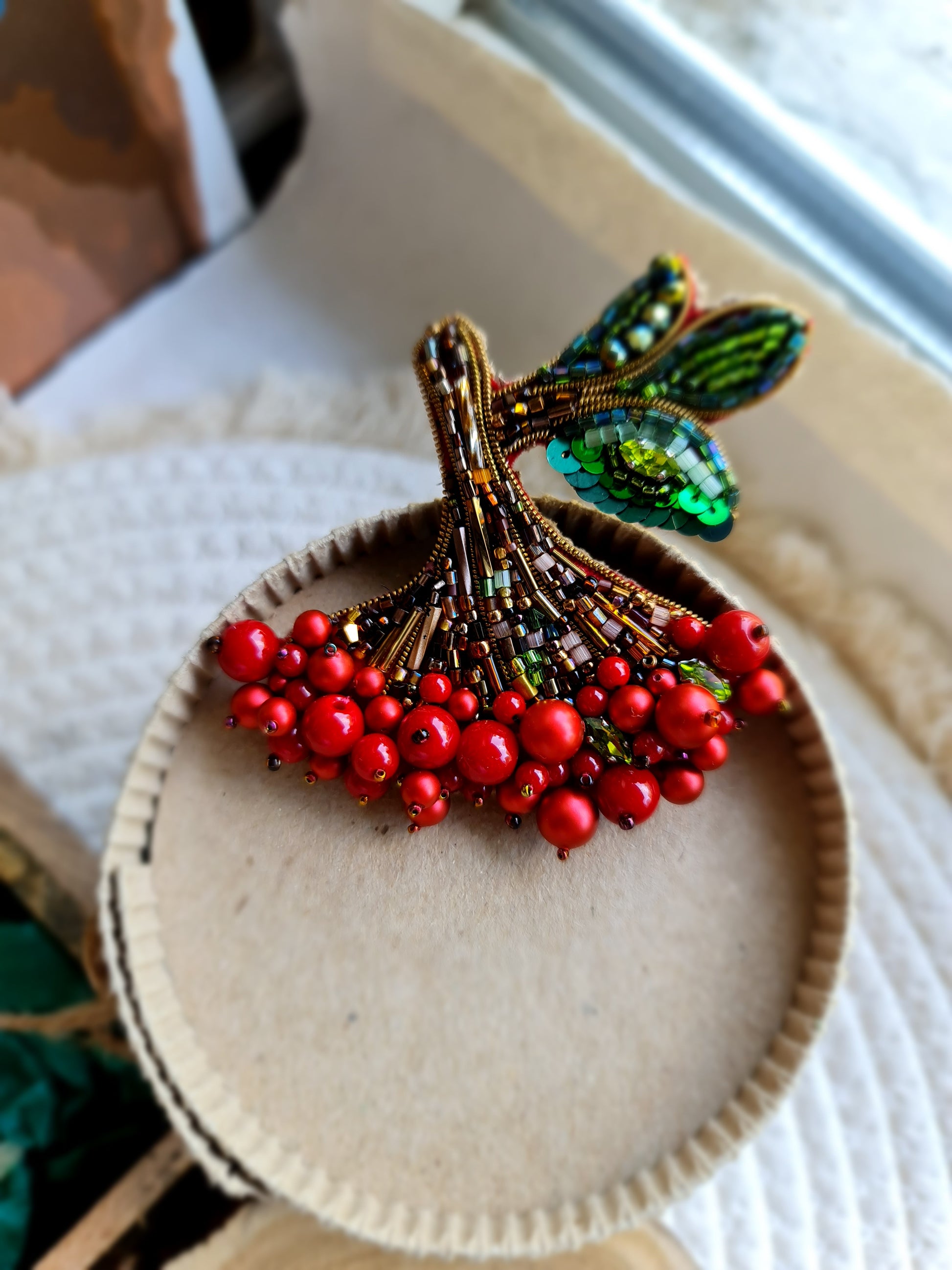 Red berry branch beaded brooch hand embroidered with green leaves and bead details