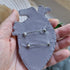 Close-up of the anatomical heart brooch showing detailed stitching and vibrant embroidered patterns.