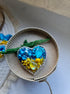 Blue and yellow heart beaded brooch hand embroidered with crystals, pearls, beads, and sparkling Ukraine-inspired details
