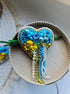 Blue and yellow heart beaded brooch hand embroidered with crystals, pearls, beads, and sparkling Ukraine-inspired details