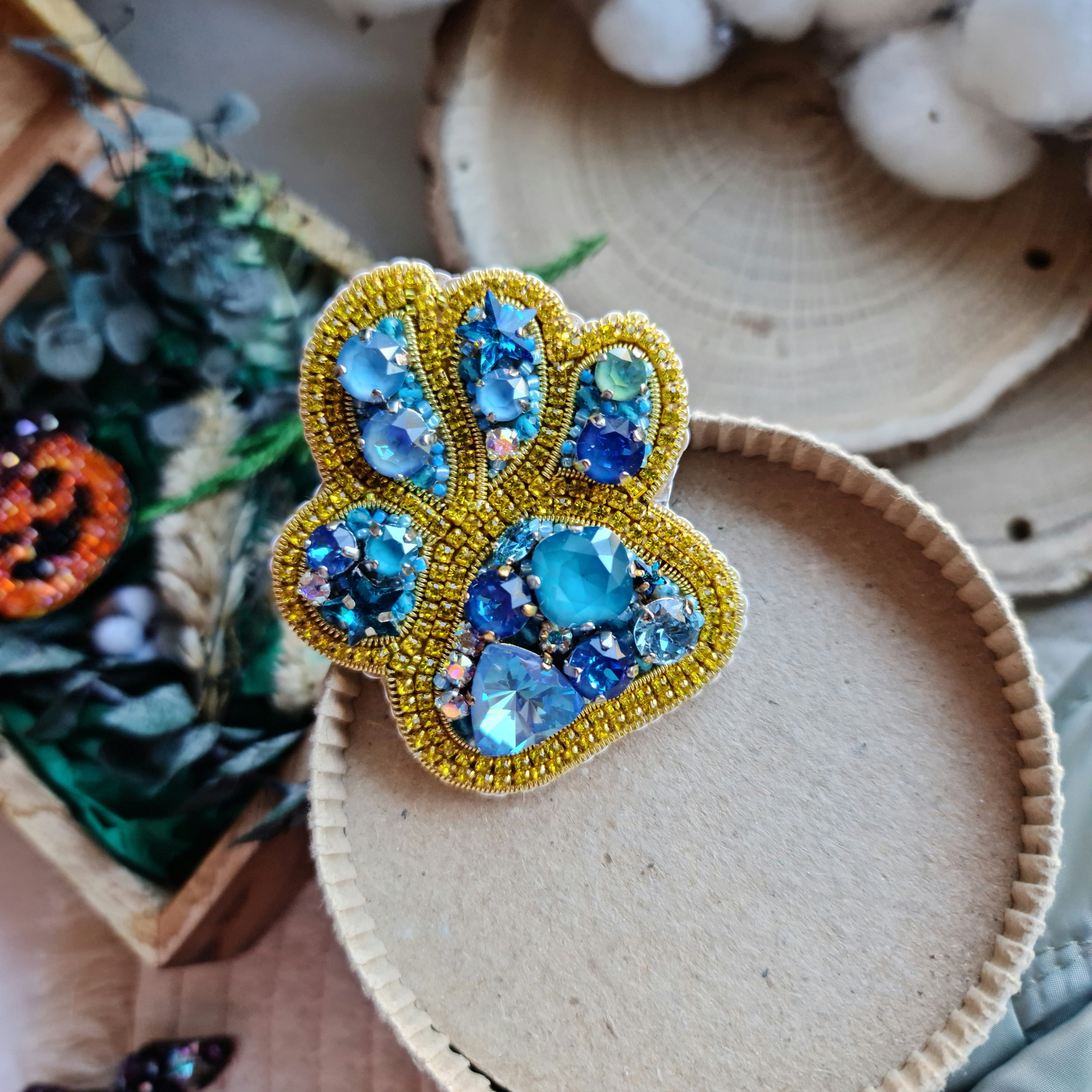 Pet paw beaded brooch hand embroidered with gold beads blue crystals and sparkling rhinestone details